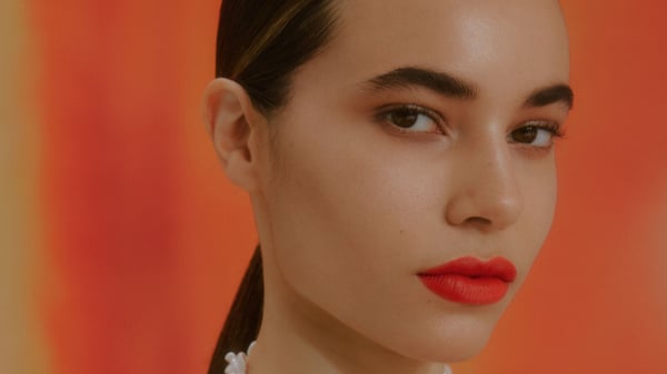 Image may contain Head Person Face Body Part Neck Accessories Jewelry and Necklace